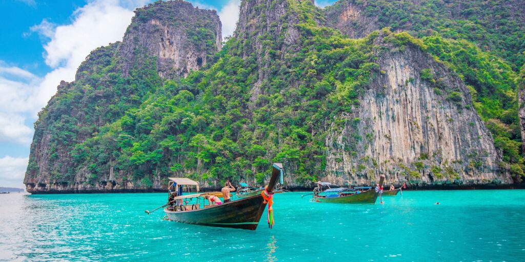 Long boat and blue water at Maya bay in Phi Phi Island, Krabi Th