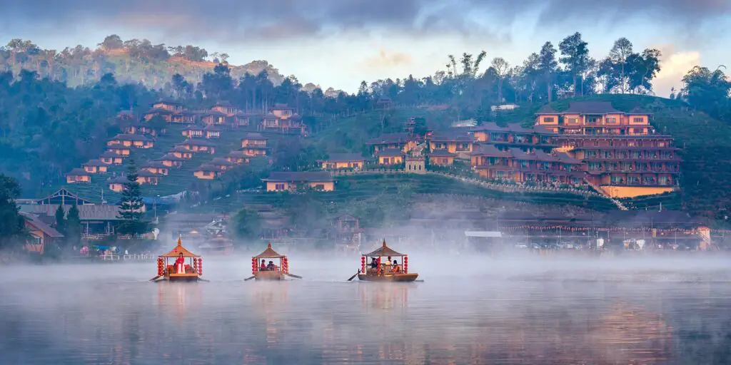 Tourists take a boat at Ban Rak Thai village in Mae Hong Son pro